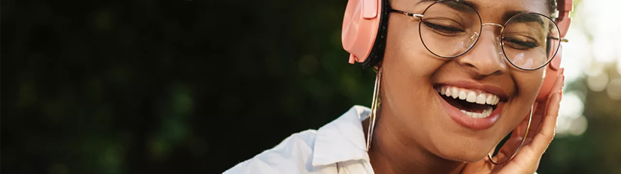 Happy lady listening to headphones